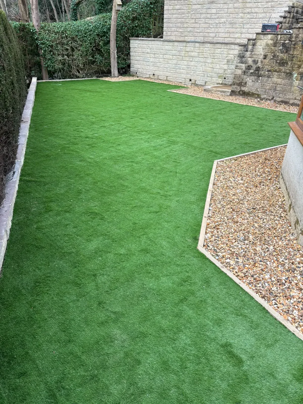 Artificial grass geometric gravel border completed by Crown Hill Contracting