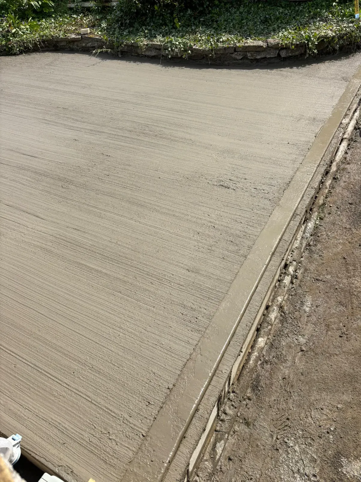 Concrete driveway finish completed by Crown Hill Contracting