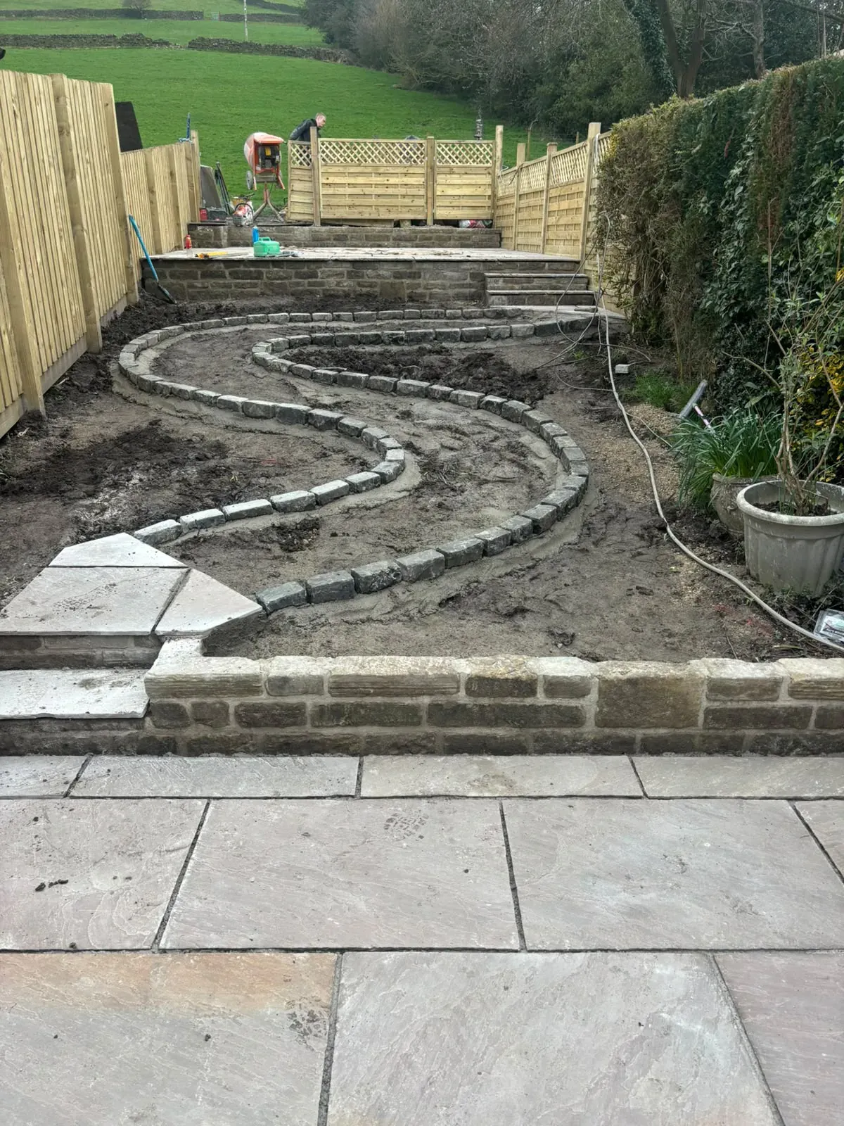 Curved garden path ground preparation completed by Crown Hill Contracting