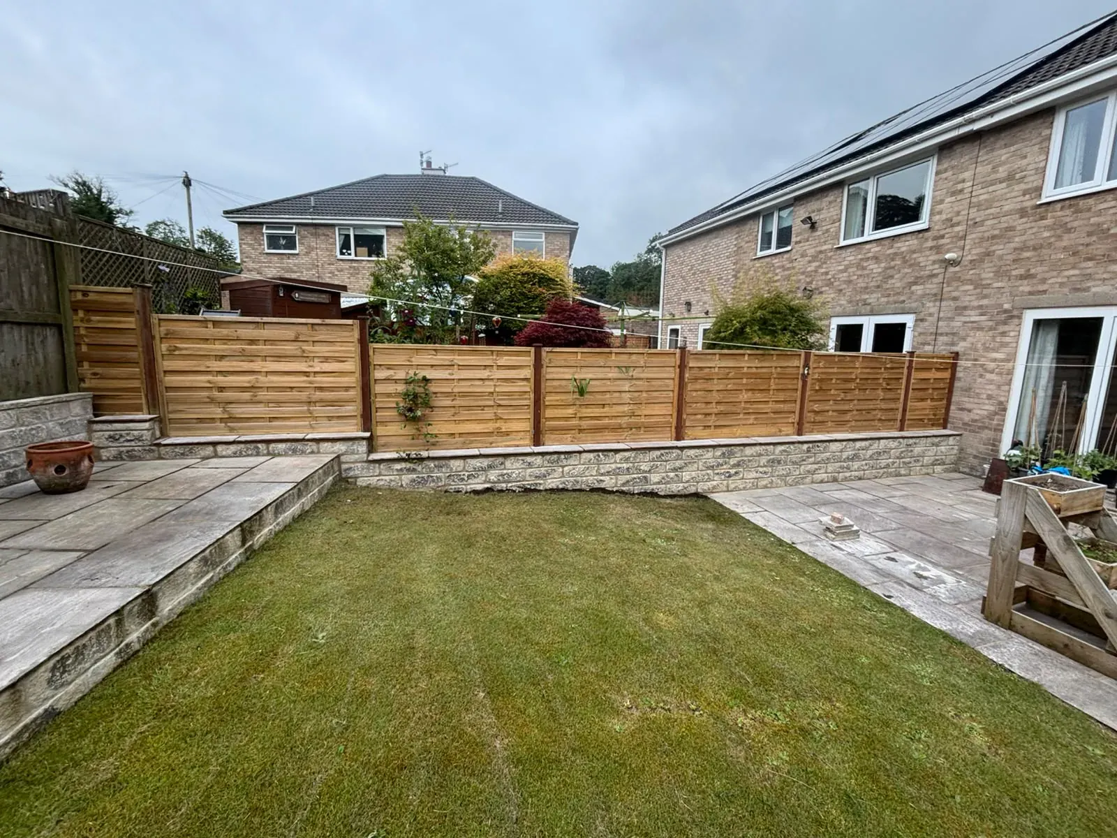 Landscaped lawn fence completed by Crown Hill Contracting