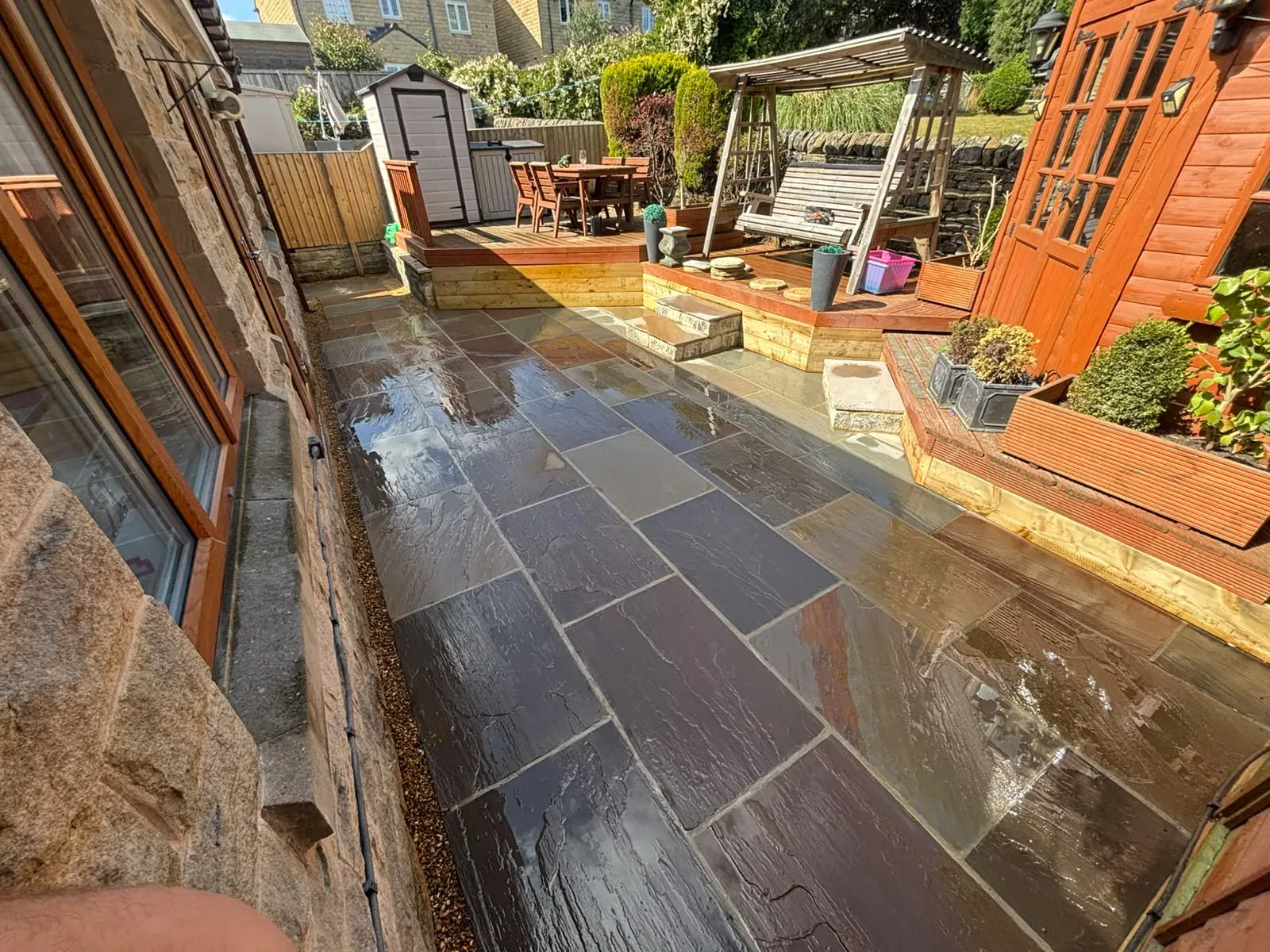Porcelain patio outdoor seating completed by Crown Hill Contracting