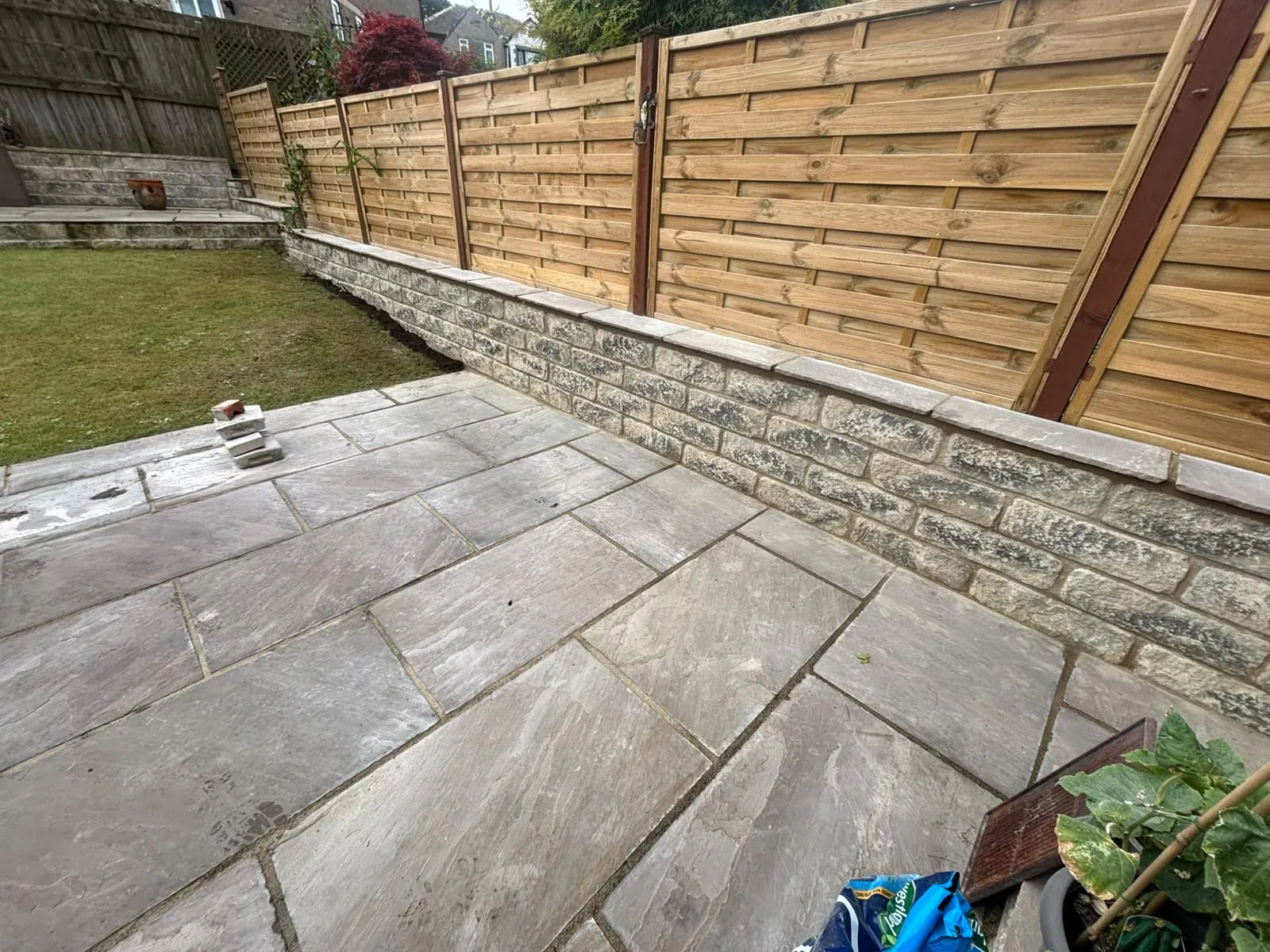 Porcelain patio timber fence completed by Crown Hill Contracting