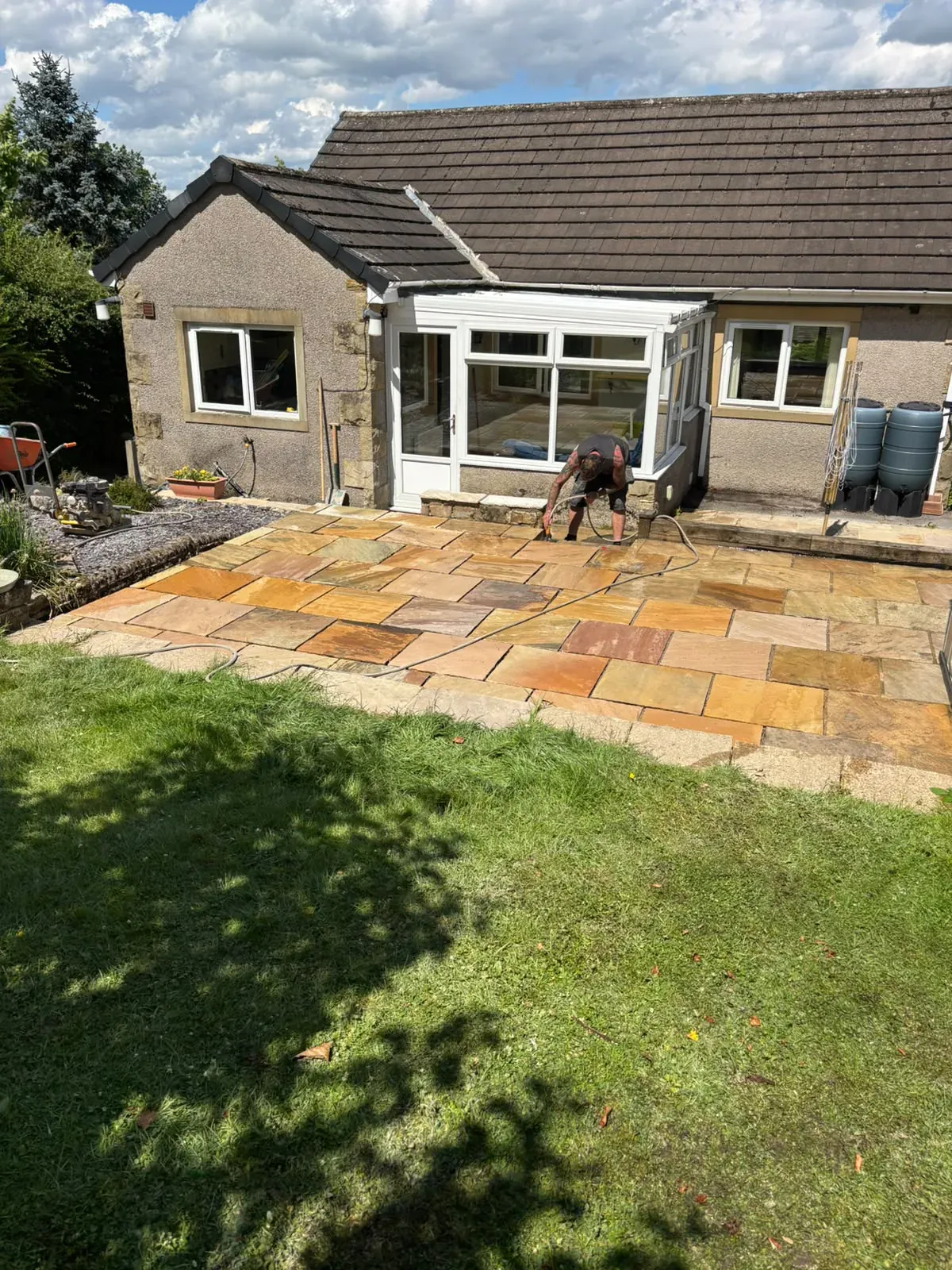 Sandstone patio wide view completed by Crown Hill Contracting