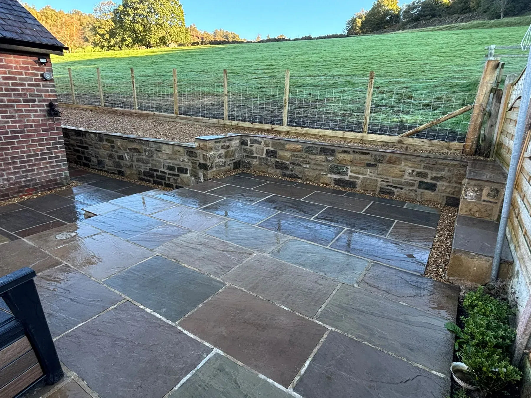 Slate patio country garden wide view completed by Crown Hill Contracting