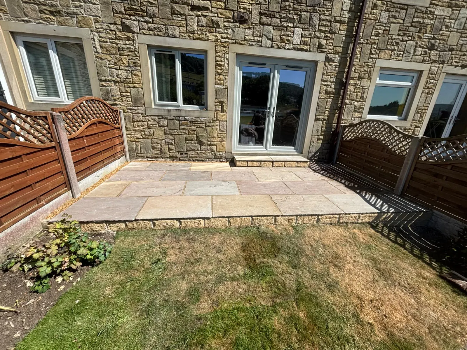 Small sandstone patio completed by Crown Hill Contracting