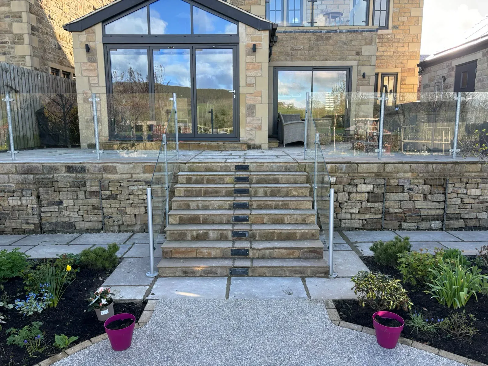 Stone steps glass balustrade completed by Crown Hill Contracting