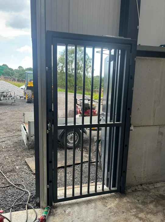 Bespoke steel security gate fabricated and fitted to a farm building